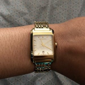 Burberry gold watch.